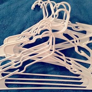 14 white plastic hungers